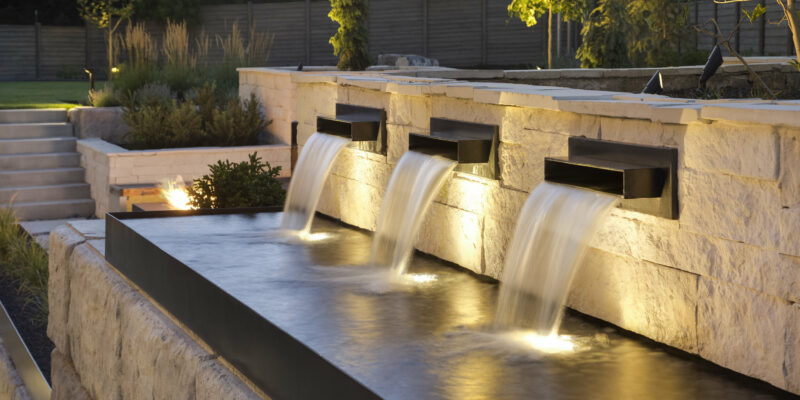 Stone retaining wall and mini pool with fountains